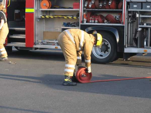 Fire fighters demonstrating hoses